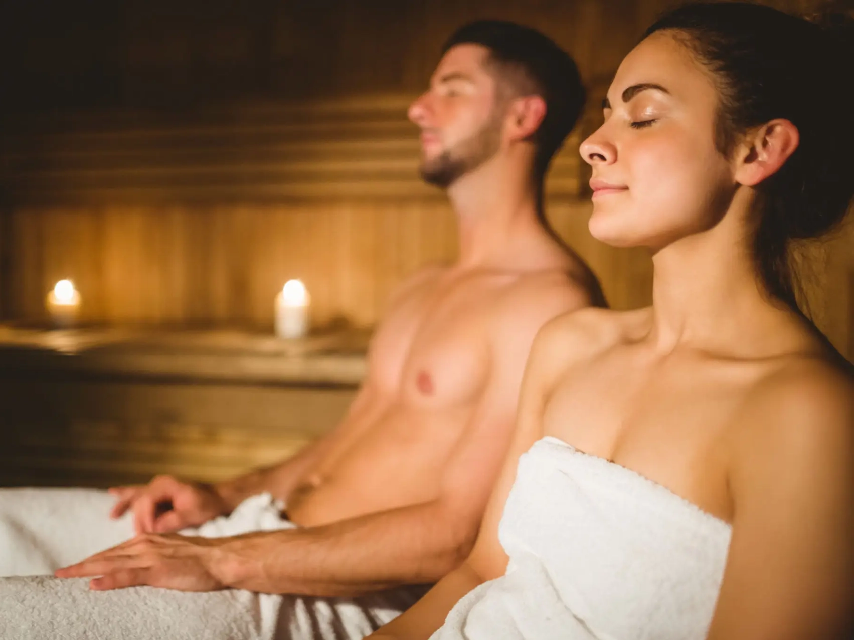 Couple relaxing in a sauna
