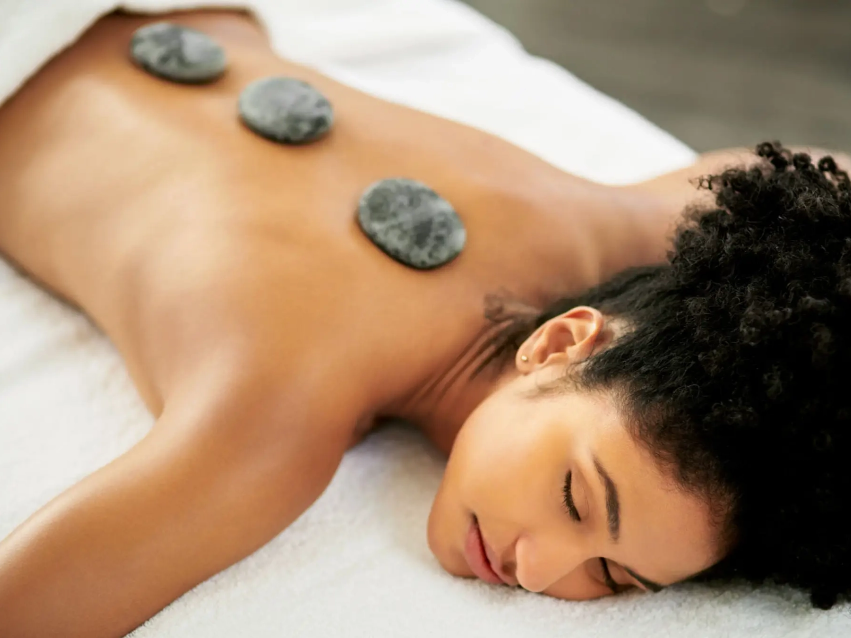 Relaxing spa treatment with hot stones