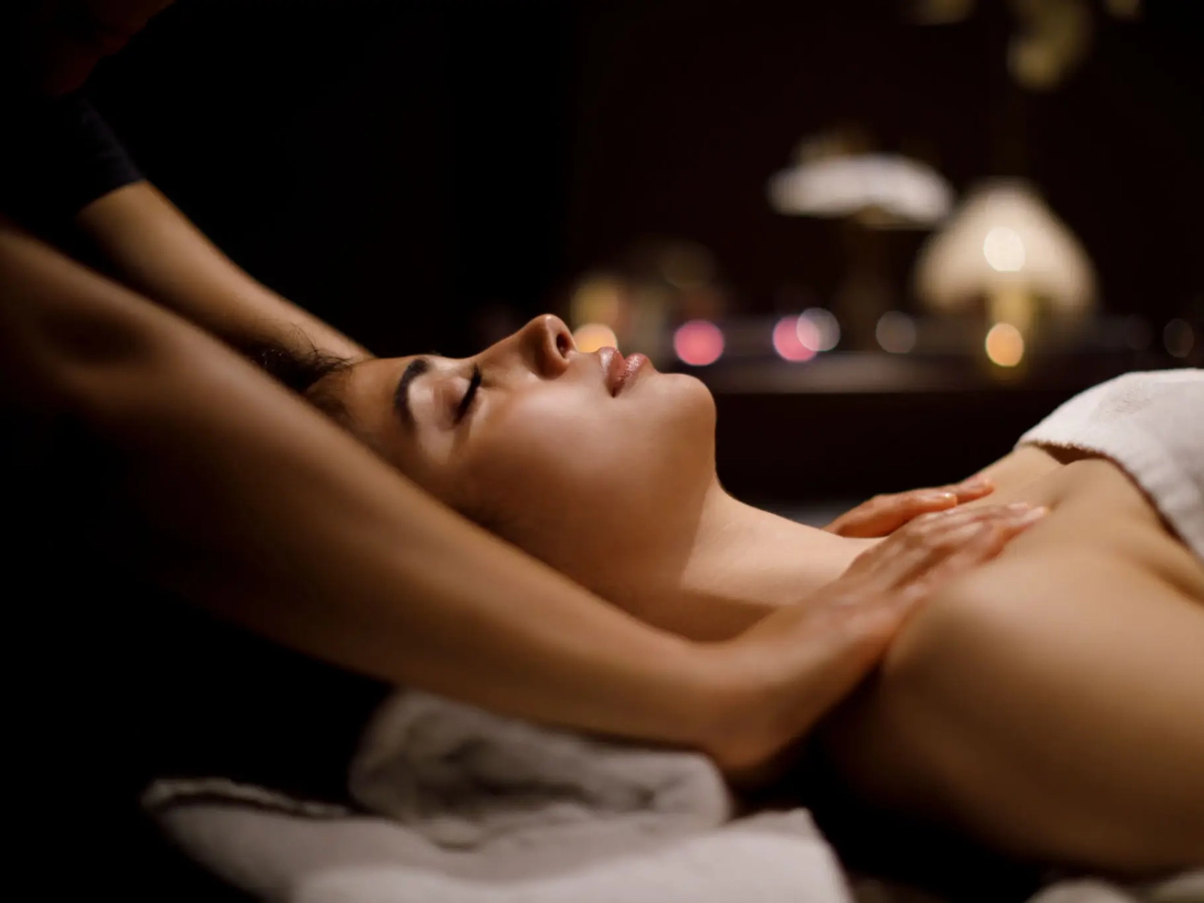 Woman receiving relaxing neck massage